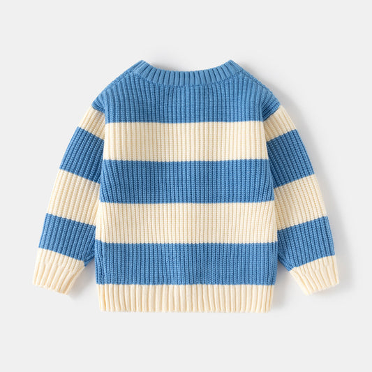 Blue and beige striped sweater on a light gray background
