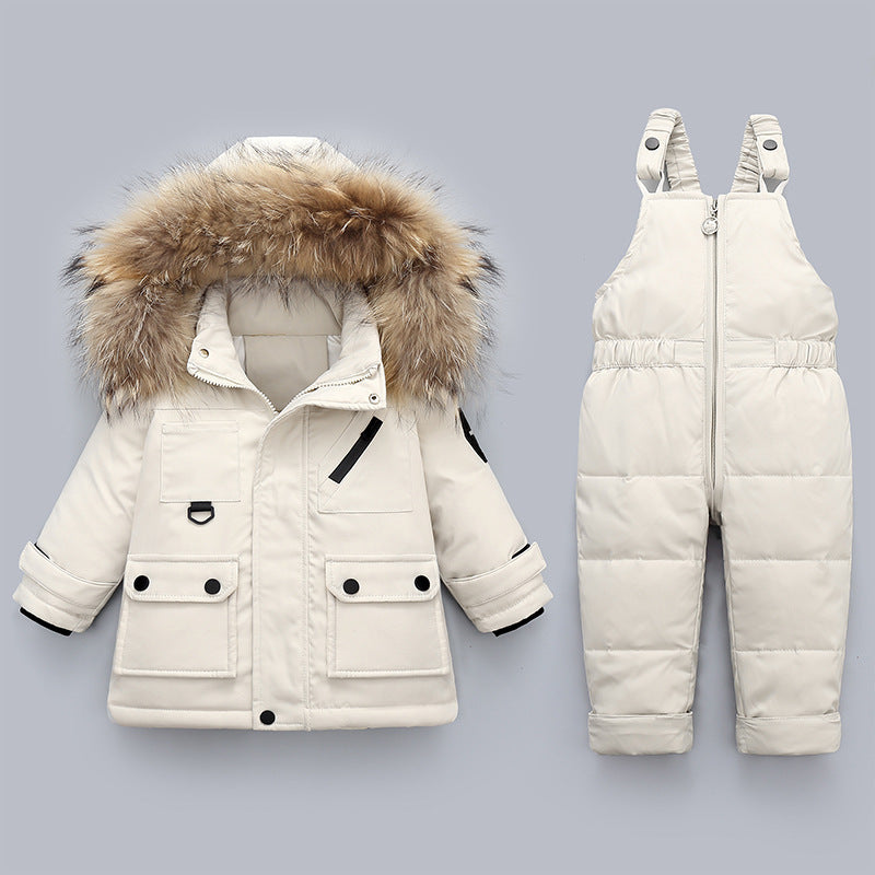 White winter coat with fur hood and matching snowsuit on a gray background