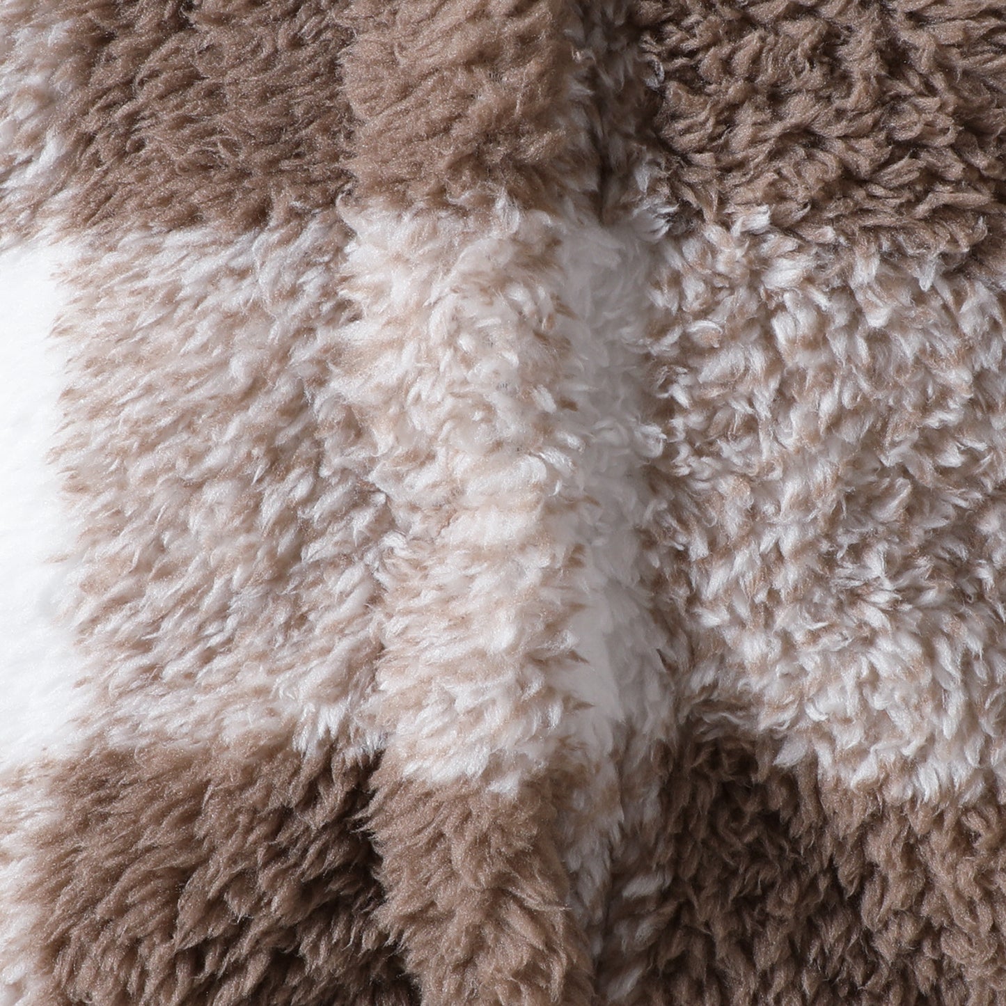 Close-up of brown and beige fluffy fabric texture