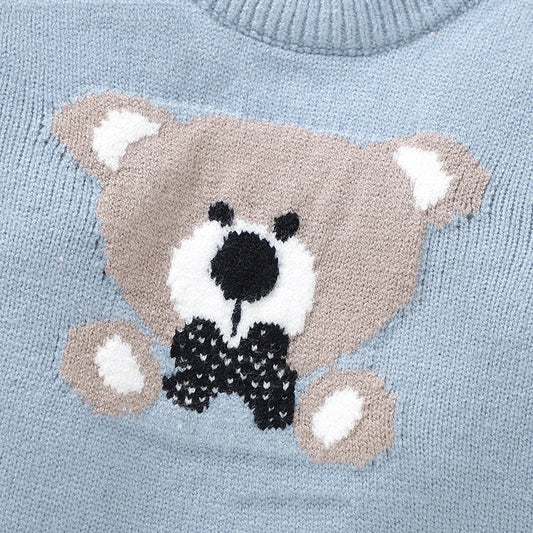 Light blue sweater with a teddy bear design on a light blue background