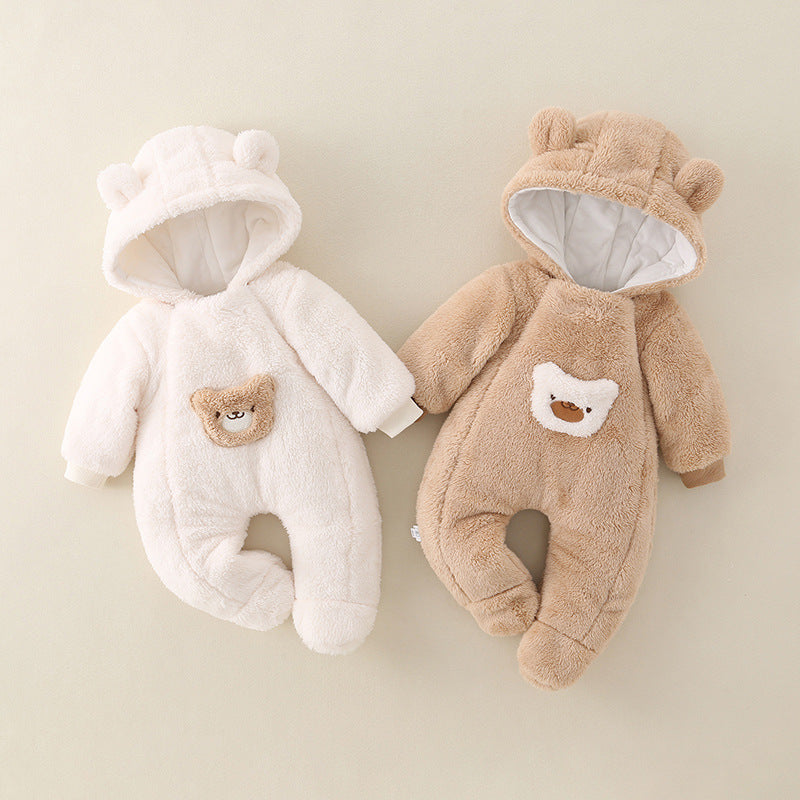 Two baby pramsuit, one white and one brown, with bear face designs on a beige background.