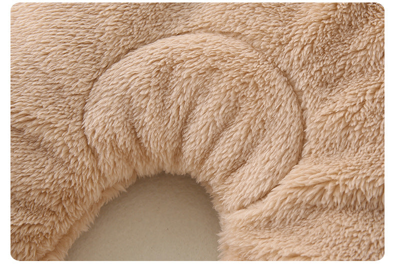 Beige bath mat with textured surface