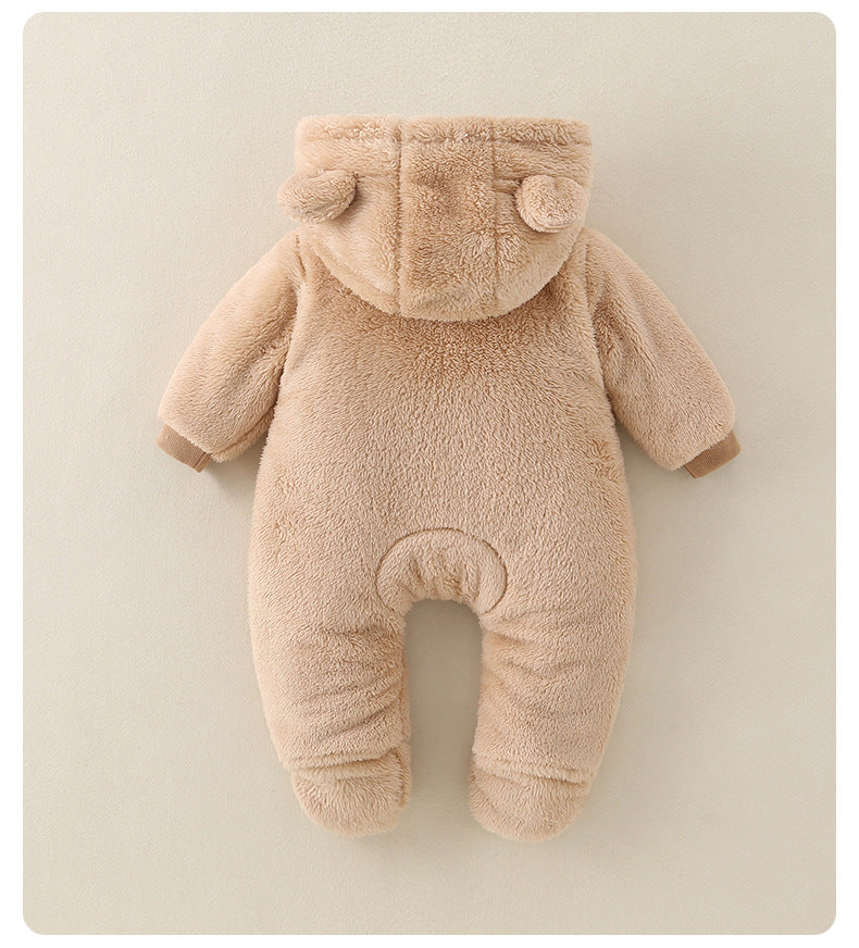 Beige baby onesie with bear ears on a beige background