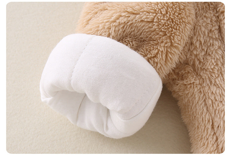 Close-up of a plush toy's paw on a beige background