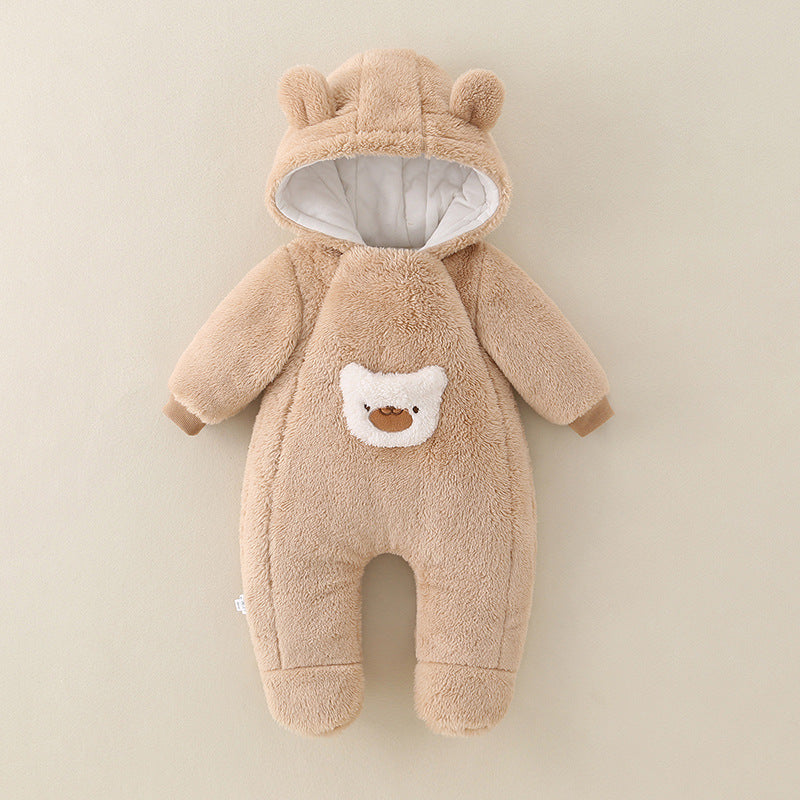Brown baby snowsuit with bear design on a beige background