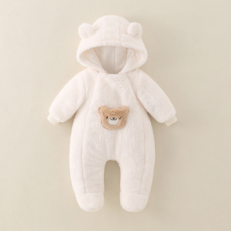 White baby snowsuit with bear design on a beige background