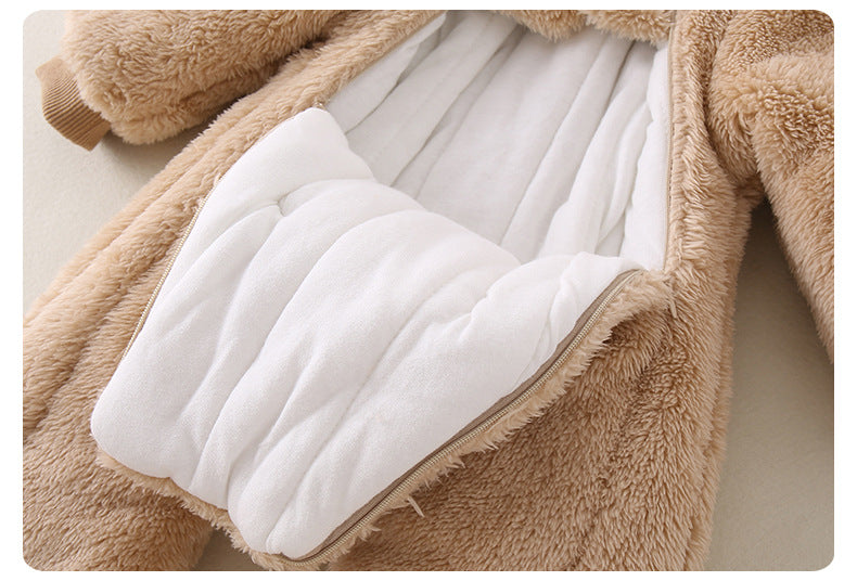 Close-up of a fluffy brown garment with white lining on a light background