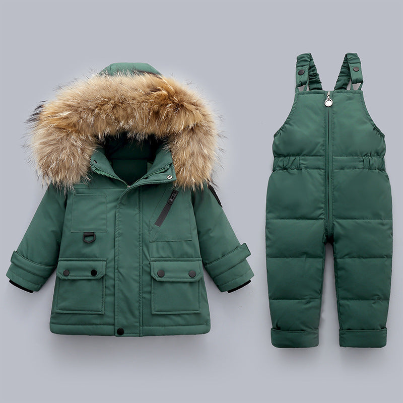 Green winter coat with fur hood and green puffer bib overalls on a gray background