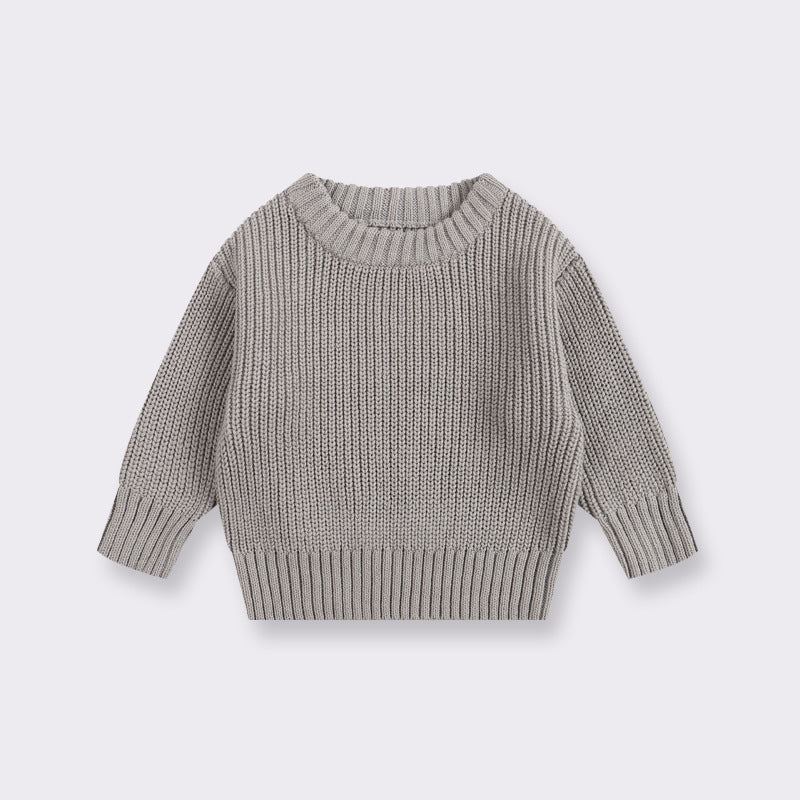 Gray knitted sweater on a light gray background