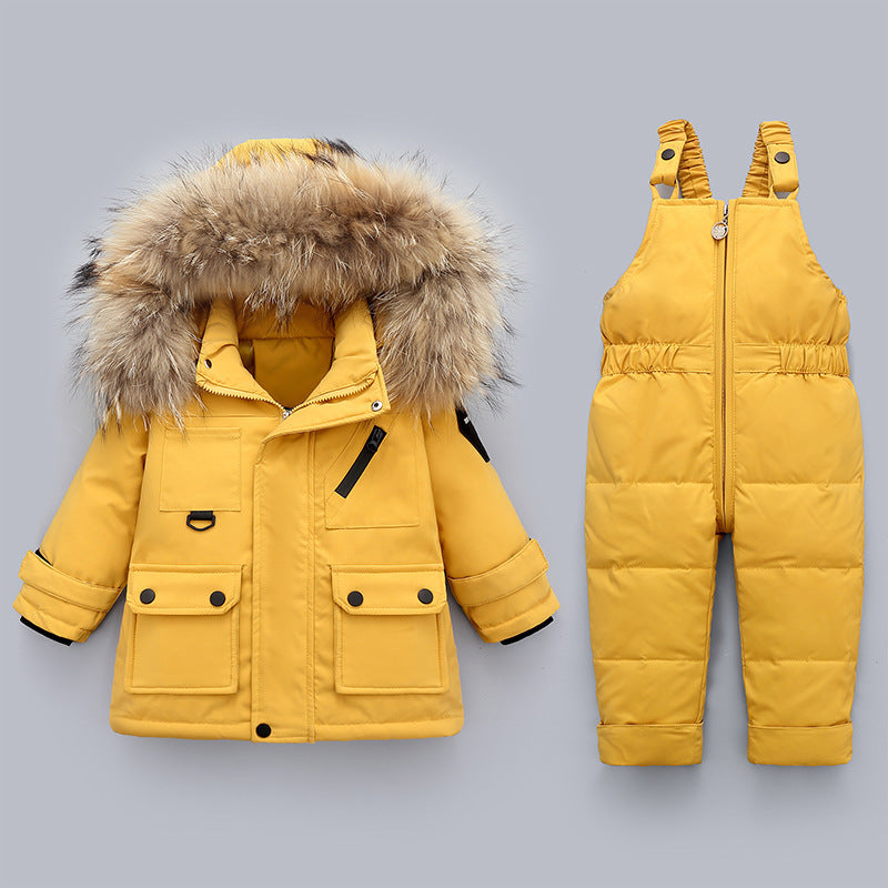 Yellow winter coat with fur hood and matching snowsuit on a gray background
