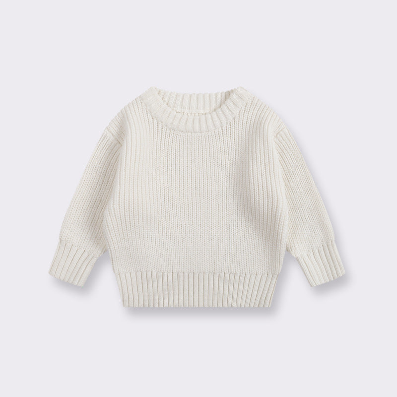 White ribbed sweater on a light gray background