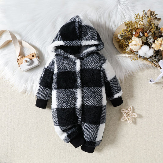 Black and white checkered baby onesie with a hood on a light background
