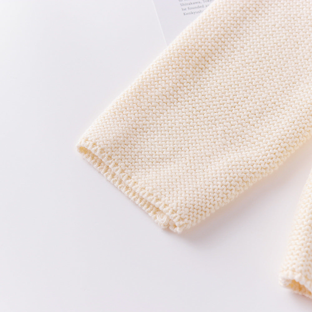Close-up of a textured white towel on a light gray background