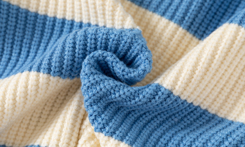 Close-up of a blue and beige striped knitted fabric