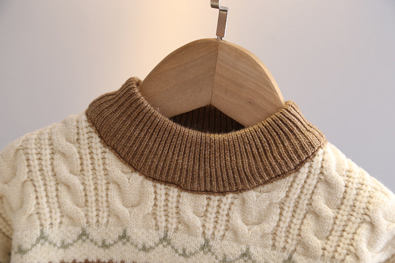 Beige sweater with brown collar on a wooden hanger against a neutral background