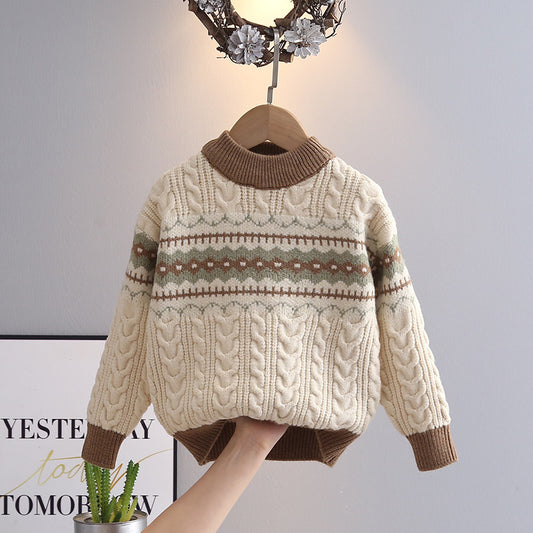 Knitted sweater with pattern on a hanger against a neutral background