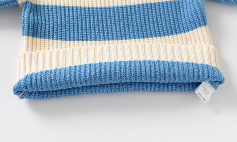 Folded blue and beige striped fabric with a tag on a white background