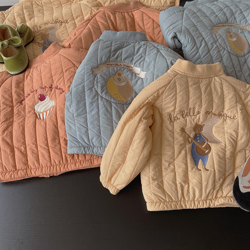 Collection of quilted jackets in various colors with embroidered designs on a dark surface.