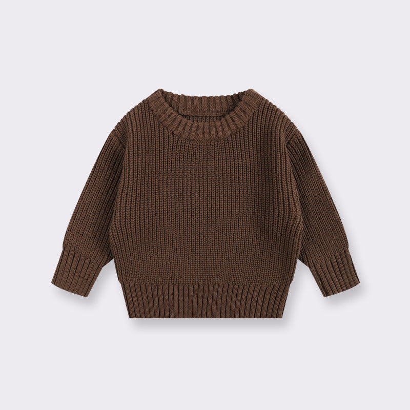 Brown knitted sweater on a light gray background